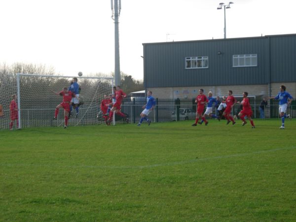 The ball is swung into the Ellwood goalmouth.