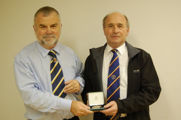 Roger Bassett (Kings  Stanley Secretary) receiving 50 year award from Derek Cumner
