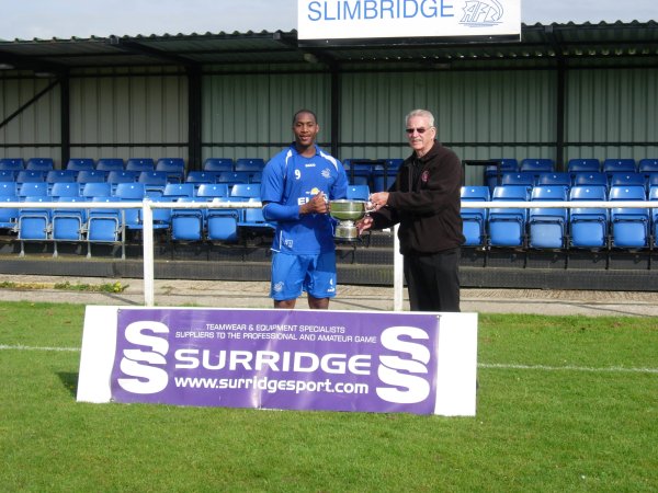 Slimbridge Captain Marvyn Roberts accepts the Trophy from League Chairman Robin Stewart